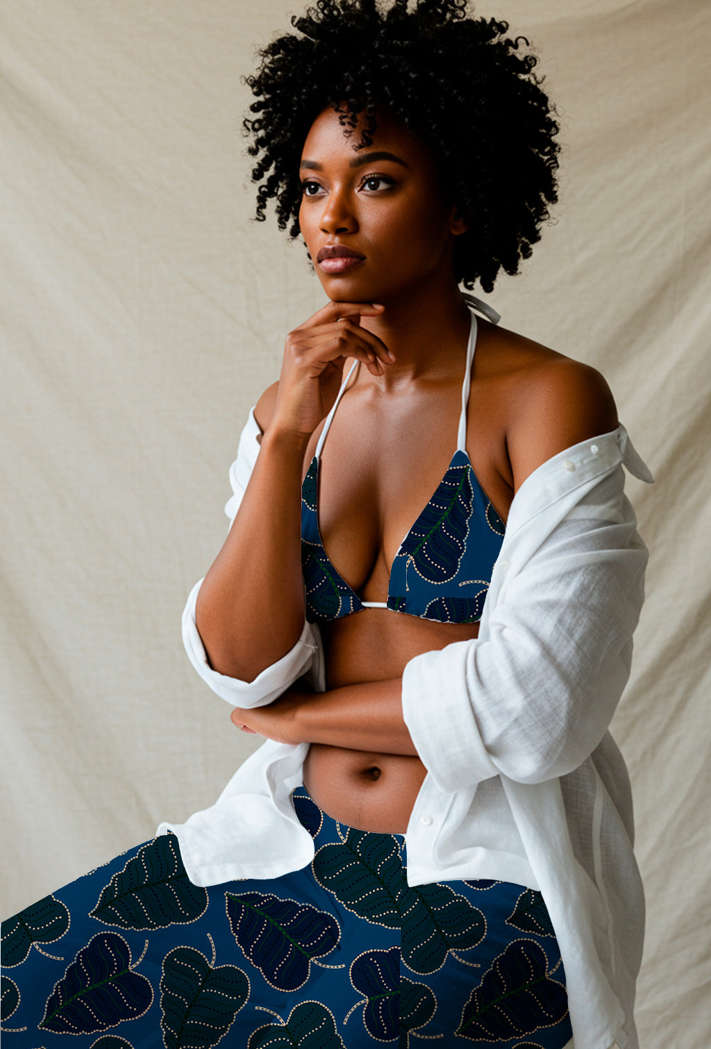 Dark dotted foliage on blue