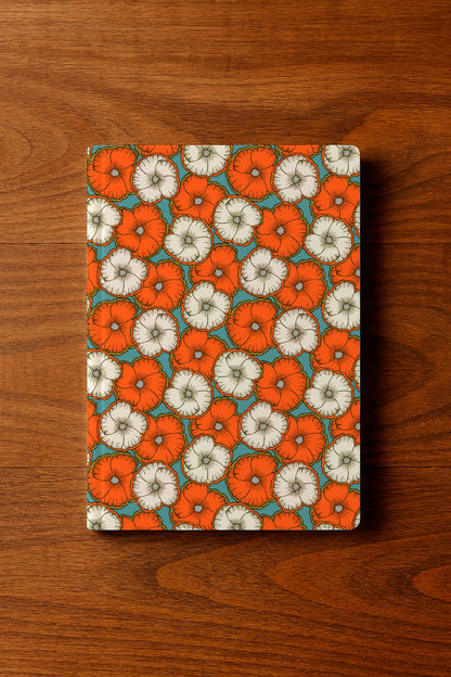 A bold floral pattern with orange and cream blossoms
