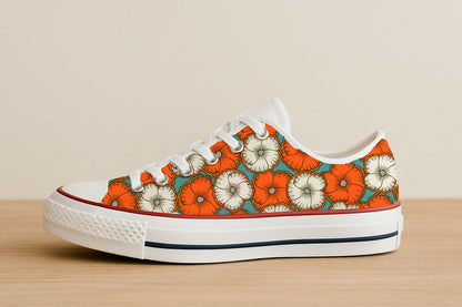 A bold floral pattern with orange and cream blossoms